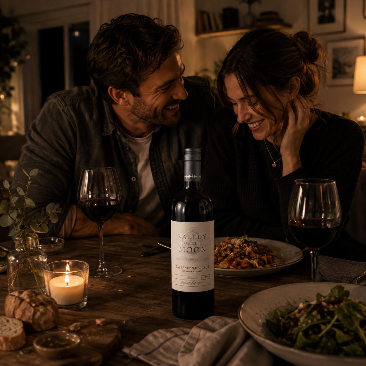 Date Night Moment. A young couple having a casual date night dinner at home with Valley of the Moon Cabernet Sauvignon