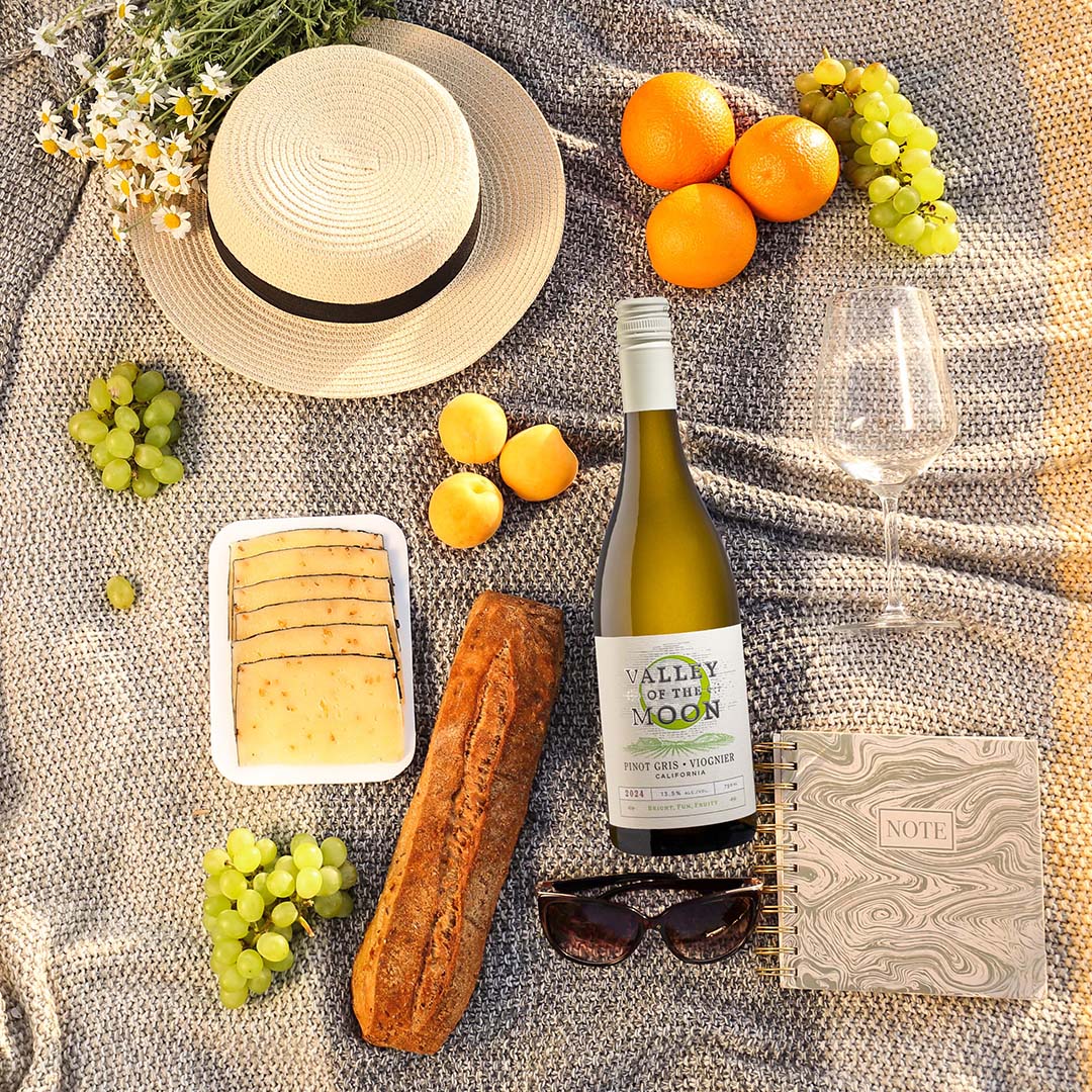 Pinot Gris/ Viognier Bottle on a beach blanket picnic scene